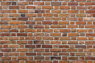 Natural old vintage weathered red brown solid brick wall. Abstract copy space background.