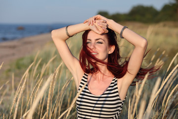 young woman hiding in the grass