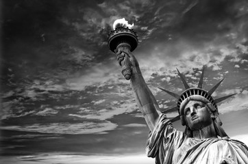 Statue of Liberty, dramatic sky background. New York City, USA © Belikova Oksana