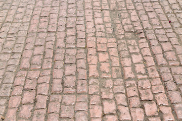 Fototapeta premium Stone pavement texture. Granite cobblestoned pavement background. Abstract background of old cobblestone pavement close-up. Seamless texture. Perfect tiled on all sides