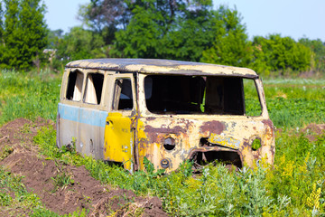 Rusty, old and abandoned van