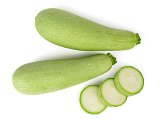 Two zucchini and zucchini rings top view on white background.