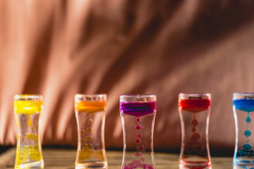Toy with water and drops of oil colors.