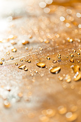 background bokeh, a drop of water golden flowers during sunset