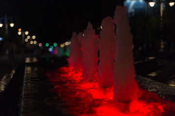 fountain with colorful illuminations at night