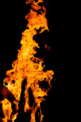 Flame of fire with sparks on a black background