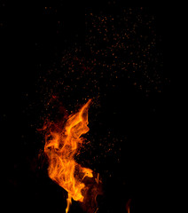 Flame of fire with sparks on a black background