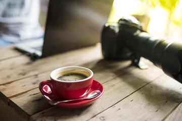 red coffee cup  of photographer