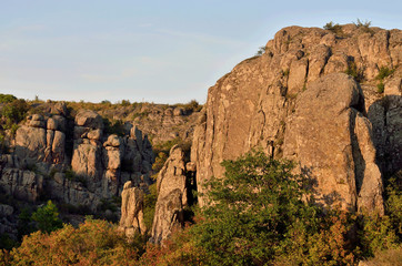 Fototapeta na wymiar View of granite Aktovo canyon (devil's valley) with beautiful stone fingers (pillars),created by Mertvovod river,natural wonder of Ukraine