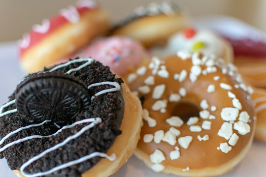 a close up shot of a selection of sweet donuts 