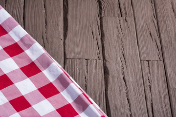Fototapeta na wymiar Rustic wooden background with checkered napkins