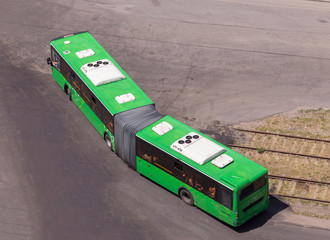 Vehicles designed to carry a large number of passengers on a city street. View from above