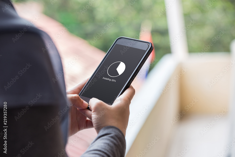 Poster installing application process on smartphone concept. woman hand holding phone doing installing upda