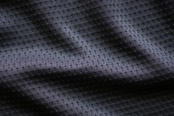 Naklejka na ściany i meble Black fabric sport clothing football jersey with air mesh texture background