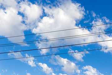 Electrical pole and wires against the sky