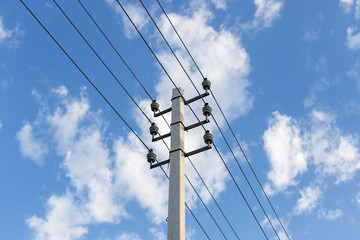 Electrical pole and wires against the sky