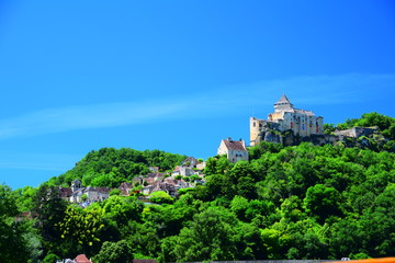 Obraz premium The fortress of Castelnaud-La-Chappelle, as seen from the Dordogne River in the Perigord region of France