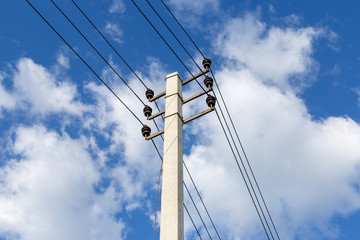 Electrical pole and wires against the sky