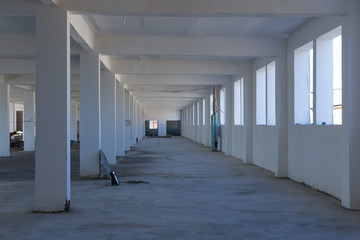 Unfinished interior of business center under construction in grey colours