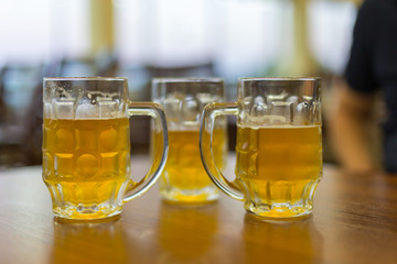 three mugs of beer on the table