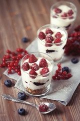 Natural yogurt with fresh berries and muesli. Healthy dessert.