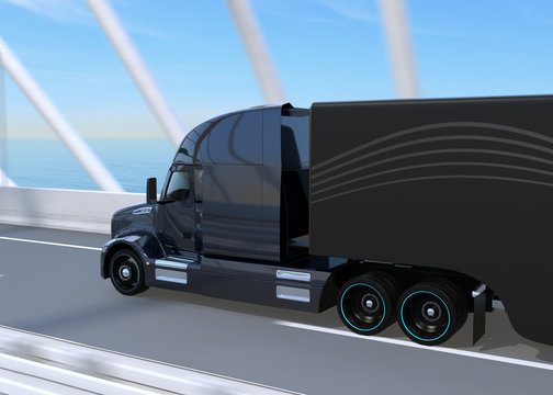 Rear view of black Fuel Cell Powered American Truck driving on highway. 3D rendering image.