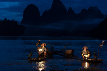 Fisherman of Guilin, Li River and Karst mountains during the blue hour of dawn,Guangxi China