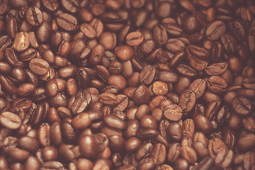 Roasted coffee bean background as dark tone background.