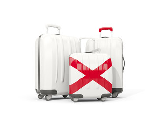 Luggage with flag of alabama. Three bags with united states local flags