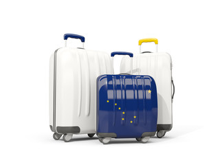 Luggage with flag of alaska. Three bags with united states local flags
