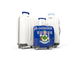 Luggage with flag of maine. Three bags with united states local flags
