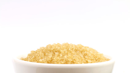 sugar, granulated sugar cane on a white cup (close up)