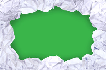 crumpled paper ball white frame on green color and copy space background, copy space in rough paper waste ball on green background for white paper ball banner advertising social