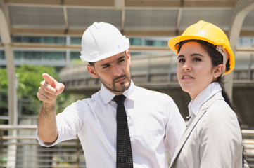 Business concept. Businessmen are working on engineering. Businessmen are planning work outside the building.