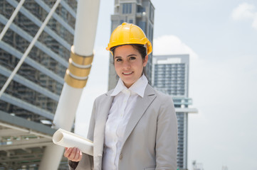 Business concept. Businesswomen are working on engineering. Businesswomen are planning work outside the building.