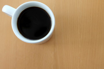 Obraz na płótnie Canvas Top view of coffee in a white mug. Copy space.