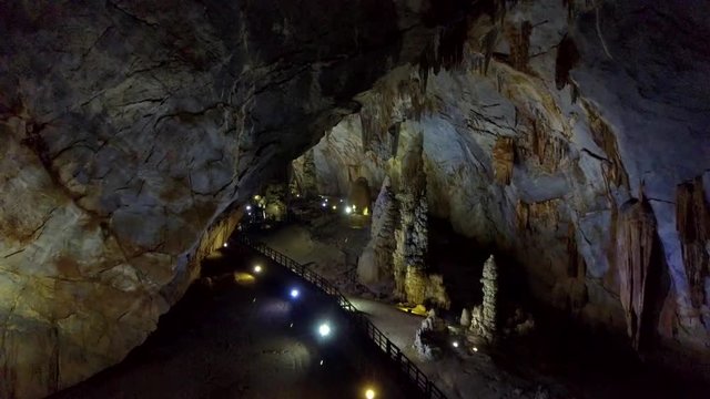 close motion to walls with stalactites flowing like curtains