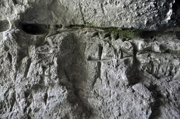 Ancient Germanic runes on the wall of the cave