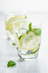 Refreshing summer drink with lemon and mint