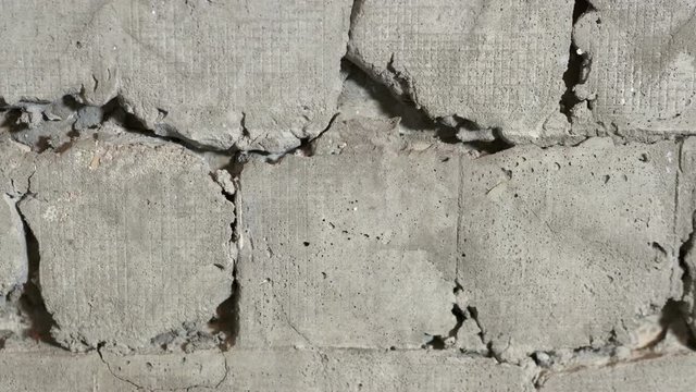  Old ceramic tiles falling off from the wall closeup
