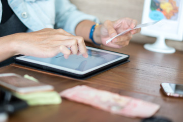 Hand use tablet for shopping online or modern business concept