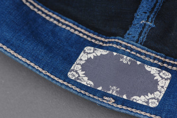 part of denim pants with label, close-up