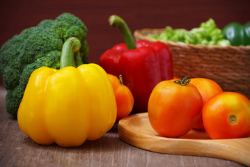 Fresh vegetables,tometos and green chilli and bell peper on wood table