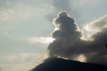 Sun is hidden in a cloud on sunset time.