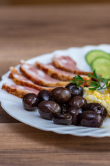 Breakfast with olives and bacon