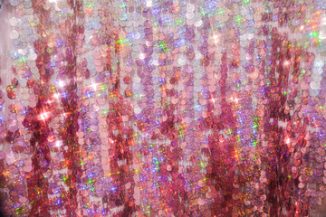 Sequins close-up macro. Abstract background with sequins colorful on the fabric. Texture scales of round sequins 