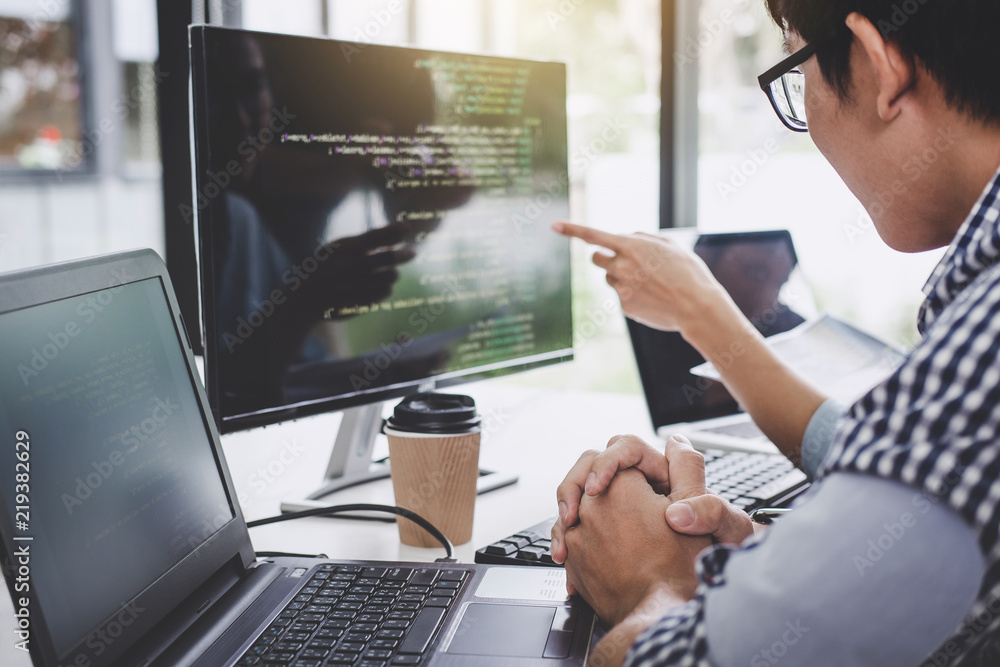 Aufkleber Programmers cooperating at Developing programming and website working in a software develop company office, writing codes and typing data code