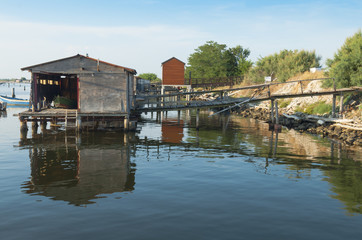 Fototapeta na wymiar Mussel cultivation, shacks at Scardovari lagoon, Po' river delta, Adriatic sea, Italy, UNESCO World Heritage Site.