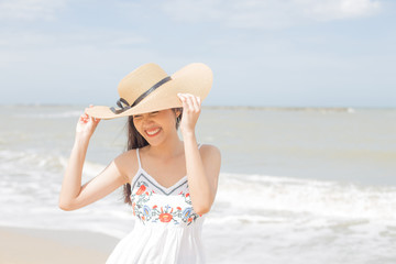 Fototapeta na wymiar Beautiful girl laughing happily on a sunny day, Hua Hin, Thailand