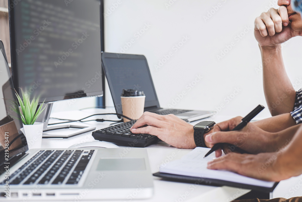 Aufkleber programmers cooperating at developing programming and website working in a software develop company 